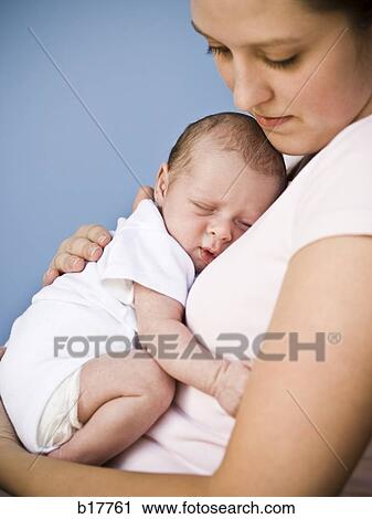 Mother holding newborn baby. View Large Photo Image Stock Image - Mother holding newborn baby.. Fotosearch