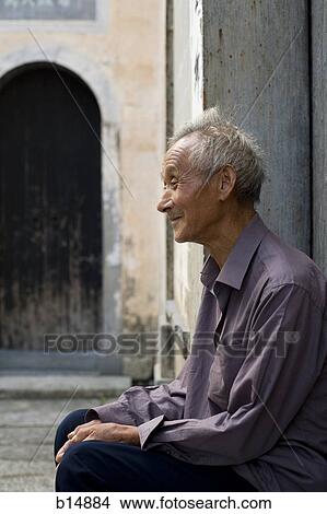 Old man sitting outdoors smiling View Large Photo Image Picture - Old man sitting outdoors smiling. Fotosearch