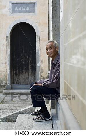 Old man sitting outdoors smiling View Large Photo Image Stock Image - Old man sitting outdoors smiling. Fotosearch