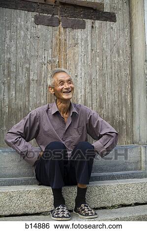 Old man sitting outdoors smiling View Large Photo Image Stock Photograph - Old man sitting outdoors smiling. Fotosearch