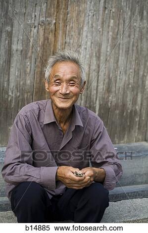Old man sitting outdoors smiling View Large Photo Image Stock Photography - Old man sitting outdoors smiling. Fotosearch