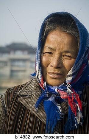 Older woman with head scarf outdoors View Large Photo Image Stock Image - Older woman with head scarf outdoors. Fotosearch