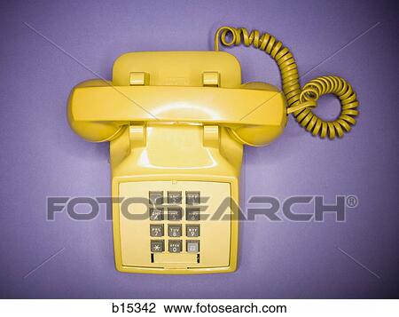 Overhead view of yellow retro phone View Large Photo Image Stock Image - Overhead view of yellow retro phone. Fotosearch