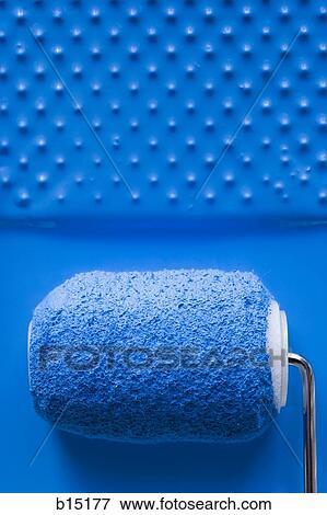 Stock Photo - Paint roller in tray with paint. Fotosearch