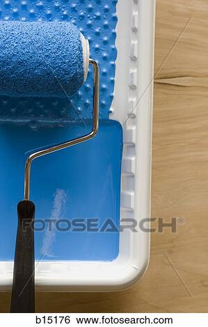 Stock Photograph - Paint roller in tray with paint. Fotosearch