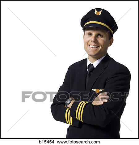 Pilot standing with arms crossed smiling View Large Photo Image Picture - Pilot standing with arms crossed smiling. Fotosearch