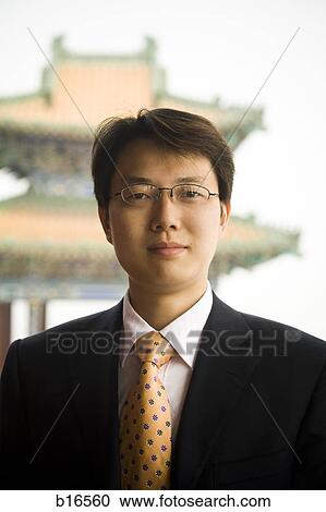 Portrait of a businessman in Asia outdoors View Large Photo Image Stock Image - Portrait of a businessman in Asia outdoors. Fotosearch
