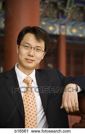 Portrait of a businessman in Asia smiling View Large Photo Image Stock Image - Portrait of a businessman in Asia smiling. Fotosearch