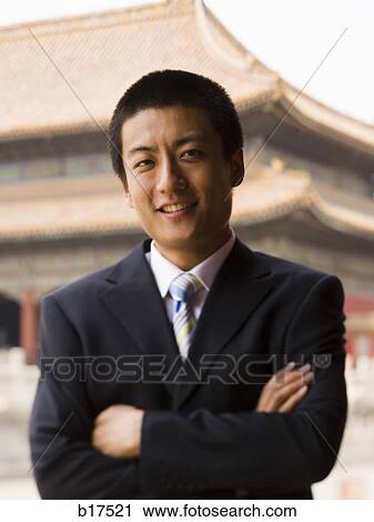 Portrait of a businessman with arms crossed outdoors View Large Photo Image Stock Image - Portrait of a businessman with arms crossed outdoors. Fotosearch