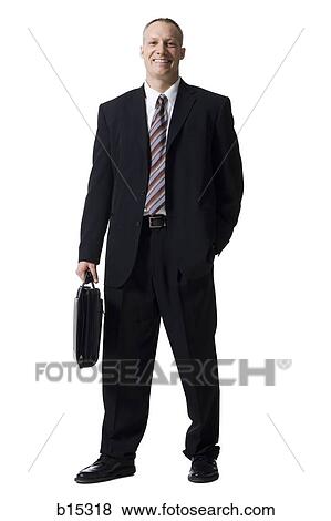 Portrait of a businessman with briefcase smiling View Large Photo Image Stock Photo - Portrait of a businessman with briefcase smiling. Fotosearch