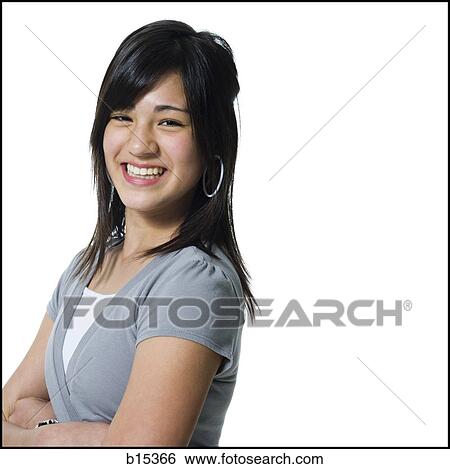 Portrait of a girl smiling with arms crossed View Large Photo Image Stock Photograph - Portrait of a girl smiling with arms crossed. Fotosearch
