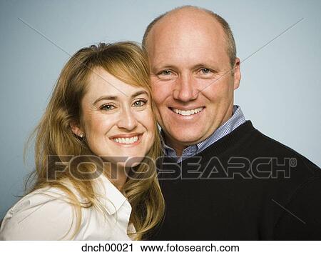 Portrait of a man and woman smiling View Large Photo Image Stock Image - Portrait of a man and woman smiling. Fotosearch