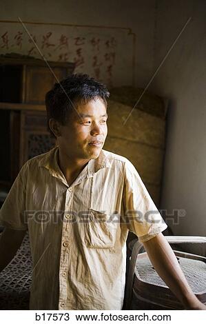 Portrait of a man smiling and looking away View Large Photo Image Stock Image - Portrait of a man smiling and looking away. Fotosearch