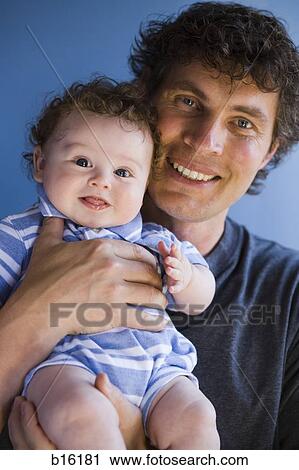 Portrait of a man with baby boy View Large Photo Image Stock Image - Portrait of a man with baby boy. Fotosearch