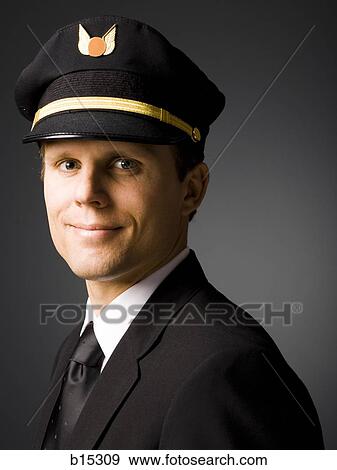 Portrait of a pilot smiling View Large Photo Image Stock Photo - Portrait of a pilot smiling. Fotosearch