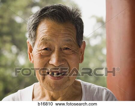 Portrait of a toothless man outdoors smiling View Large Photo Image Stock Image - Portrait of a toothless man outdoors smiling. Fotosearch