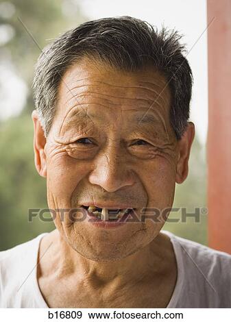 Portrait of a toothless man outdoors smiling View Large Photo Image Stock Photo - Portrait of a toothless man outdoors smiling. Fotosearch
