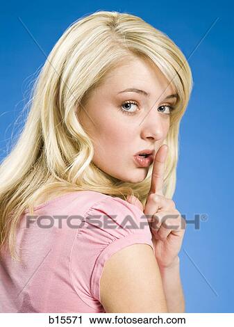 Portrait of a woman hushing View Large Photo Image Stock Image - Portrait of a woman hushing. Fotosearch