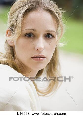 Stock Photo - Portrait of a woman outdoors. Fotosearch