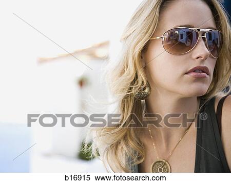 Portrait of a woman with sunglasses outdoors View Large Photo Image Stock Photography - Portrait of a woman with sunglasses outdoors. Fotosearch
