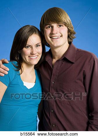 Portrait of a young couple smiling View Large Photo Image Picture - Portrait of a young couple smiling. Fotosearch