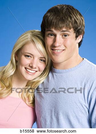 Portrait of a young couple smiling View Large Photo Image Stock Photo - Portrait of a young couple smiling. Fotosearch