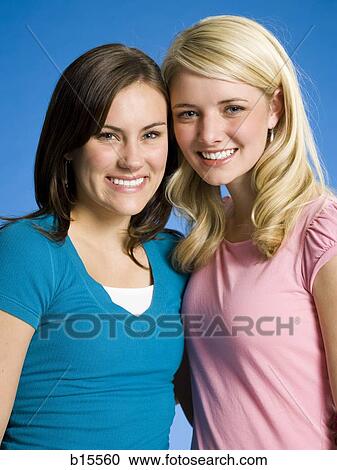 Portrait of two girls smiling View Large Photo Image Stock Image - Portrait of two girls smiling. Fotosearch