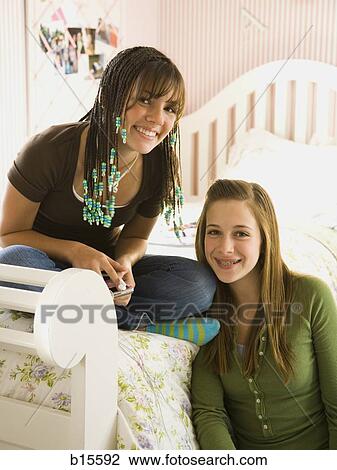 Portrait of two girls smiling View Large Photo Image Stock Image - Portrait of two girls smiling. Fotosearch