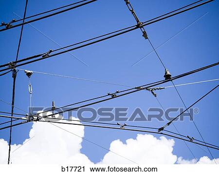Power lines with blue sky and clouds View Large Photo Image Stock Image - Power lines with blue sky and clouds. Fotosearch