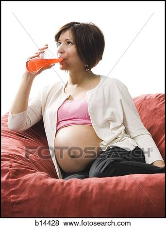 Stock Photo - Pregnant Woman drinking.. Fotosearch