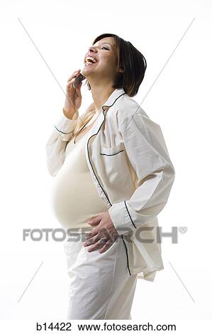 Stock Image - Pregnant Woman on the phone.. Fotosearch