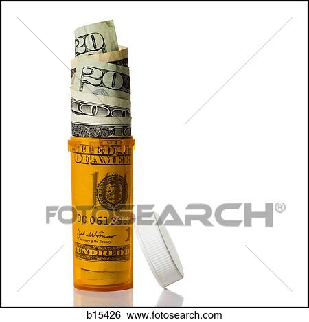 Stock Photograph - Prescription bottle filled with US currency. Fotosearch