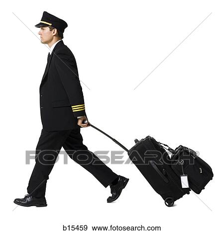 Profile of male pilot with luggage View Large Photo Image Stock Photo - Profile of male pilot with luggage. Fotosearch