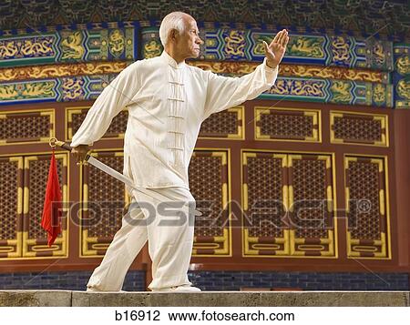 Profile of man with sword outdoors View Large Photo Image Stock Image - Profile of man with sword outdoors. Fotosearch