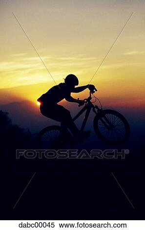 Profile of mountain biker at sunset View Large Photo Image Stock Photography - Profile of mountain biker at sunset. Fotosearch