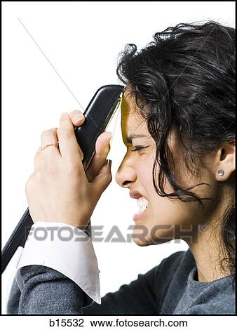 Profile of woman attaching sticky note to forehead with stapler View Large Photo Image Stock Image - Profile of woman attaching sticky note to forehead with stapler. Fotosearch