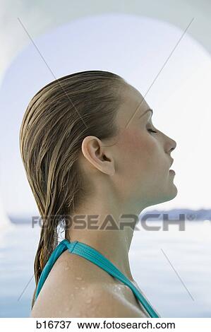 Profile of woman in bathing suit with wet hair View Large Photo Image Stock Photo - Profile of woman in bathing suit with wet hair. Fotosearch