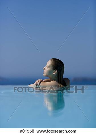 Profile of woman in pool with eyes closed View Large Photo Image Stock Photo - Profile of woman in pool with eyes closed. Fotosearch