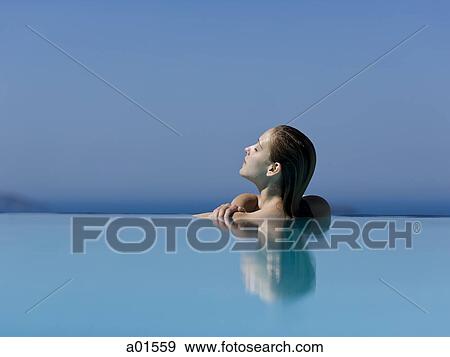 Profile of woman in pool with eyes closed View Large Photo Image Stock Photo - Profile of woman in pool with eyes closed. Fotosearch