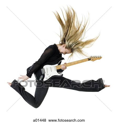 Profile of woman jumping with electric guitar View Large Photo Image Stock Photo - Profile of woman jumping with electric guitar. Fotosearch