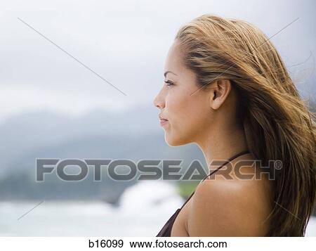 Stock Photo - Profile of woman outdoors. Fotosearch