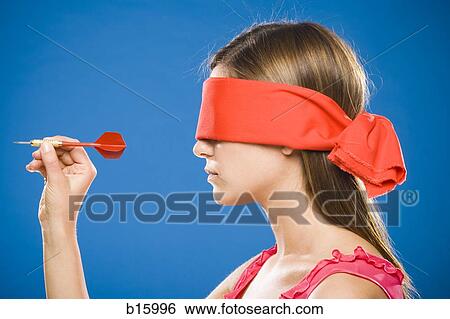 Profile of woman with dart blindfolded View Large Photo Image Stock Photograph - Profile of woman with dart blindfolded. Fotosearch