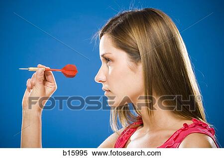 Profile of woman with dart View Large Photo Image Stock Photography - Profile of woman with dart. Fotosearch