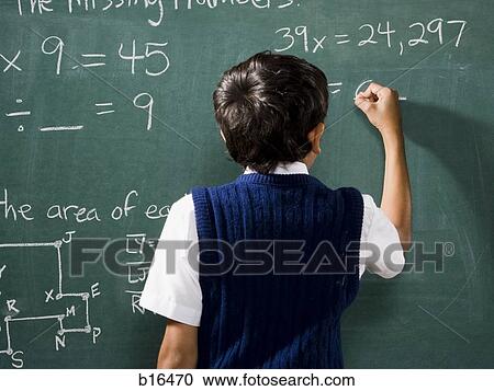Rear view of boy at chalkboard doing math formulas View Large Photo Image Stock Image - Rear view of boy at chalkboard doing math formulas. Fotosearch