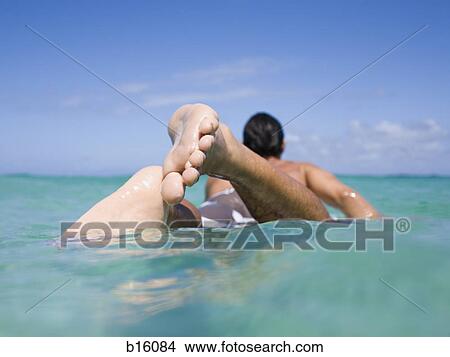 Rear view of man in water View Large Photo Image Picture - Rear view of man in water. Fotosearch