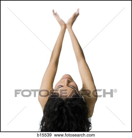 Rear view of woman with arms up and head back View Large Photo Image Stock Photo - Rear view of woman with arms up and head back. Fotosearch