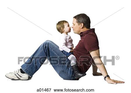 Side profile of man and baby sitting face to face View Large Photo Image Stock Photo - Side profile of man and baby sitting face to face. Fotosearch