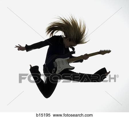 Side profile silhouette of woman jumping with electric guitar View Large Photo Image Stock Photography - Side profile silhouette of woman jumping with electric guitar. Fotosearch