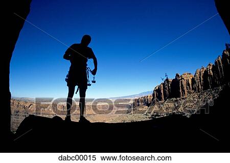 Silhouette of man from cave with harness and large rocks View Large Photo Image Stock Photography - Silhouette of man from cave with harness and large rocks. Fotosearch