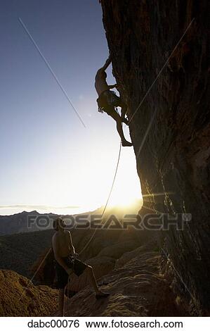 Man Climbing Mountain Silhouette